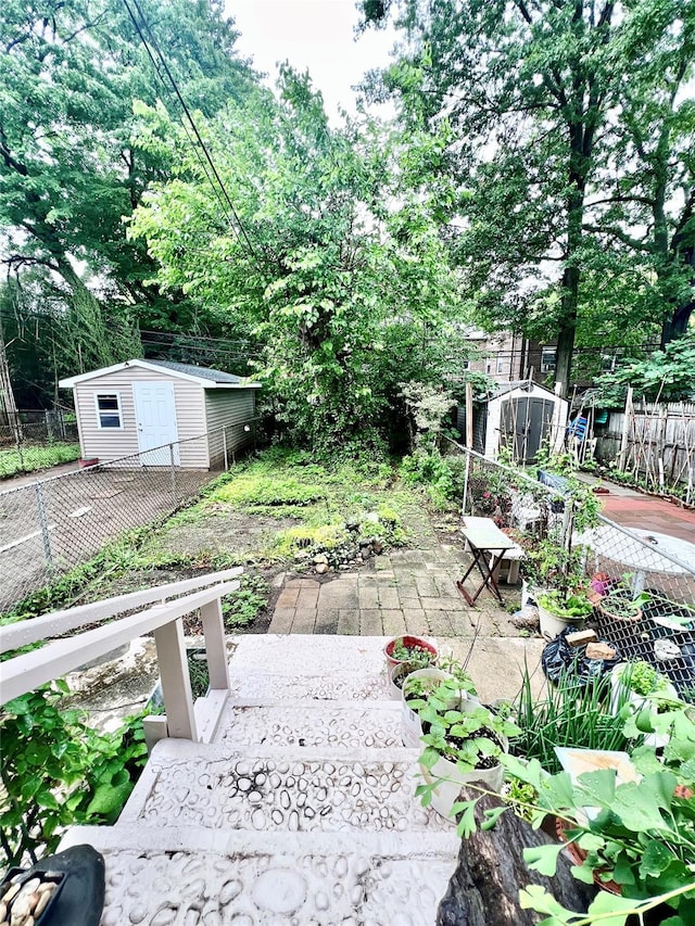 4328 195th St, Flushing, NY 11358 - view of yard with a shed and a patio area