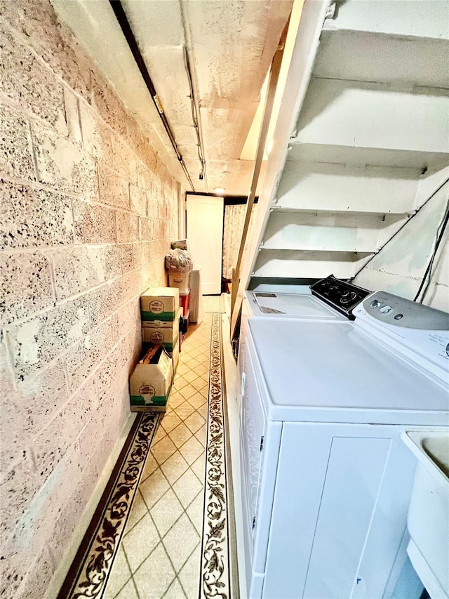 4328 195th St, Flushing, NY 11358 - laundry area with washer and dryer and light tile patterned floors