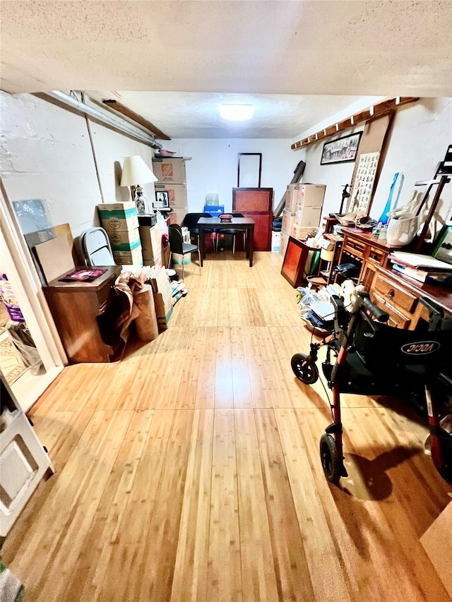 4328 195th St, Flushing, NY 11358 - finished basement with hardwood / wood-style flooring and a textured ceiling