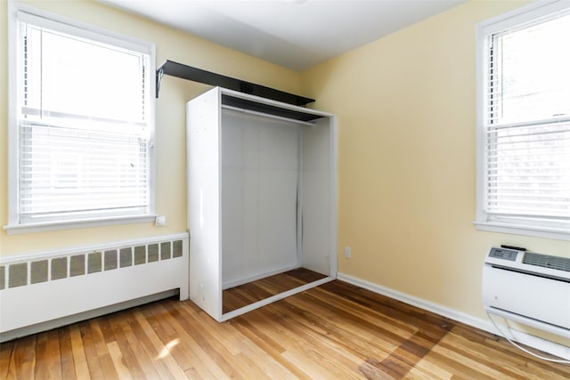 325 Palmer Ter Unit 1D, Mamaroneck, NY 10543 - unfurnished bedroom with radiator and light wood-type flooring