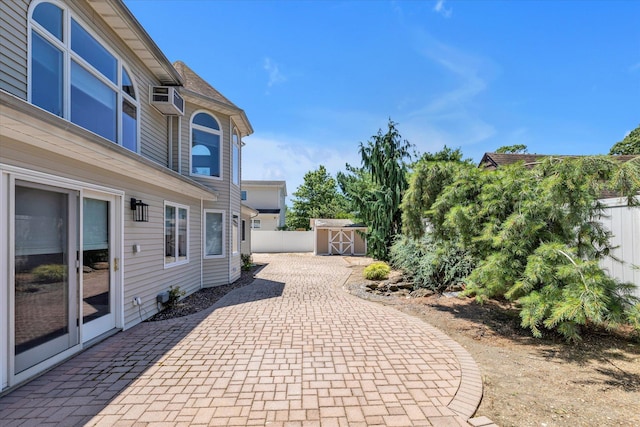 2080 Beech St, Wantagh, NY 11793 - view of patio featuring a storage shed