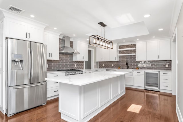 2080 Beech St, Wantagh, NY 11793 - kitchen with stainless steel fridge with ice dispenser, wine cooler, wall chimney range hood, white cabinetry, and tasteful backsplash