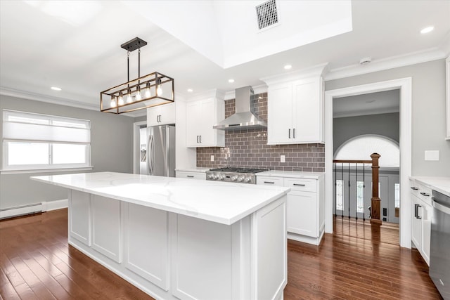 2080 Beech St, Wantagh, NY 11793 - kitchen with appliances with stainless steel finishes, wall chimney range hood, a kitchen island, white cabinets, and dark wood-type flooring