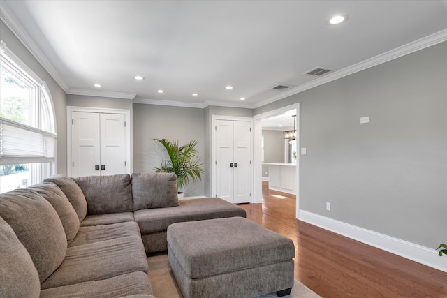 2080 Beech St, Wantagh, NY 11793 - living room featuring recessed lighting, a chandelier, wood finished floors, and crown molding