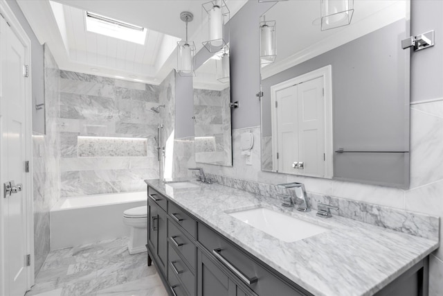 2080 Beech St, Wantagh, NY 11793 - bathroom featuring double vanity, a skylight, bathing tub / shower combination, marble finish flooring, and tile walls