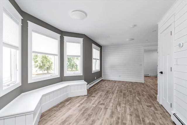 2080 Beech St, Wantagh, NY 11793 - unfurnished room featuring a baseboard radiator and light wood-style floors