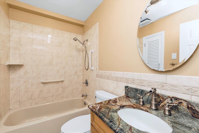 2080 Beech St, Wantagh, NY 11793 - bathroom featuring  shower combination, vanity, wainscoting, and tile walls
