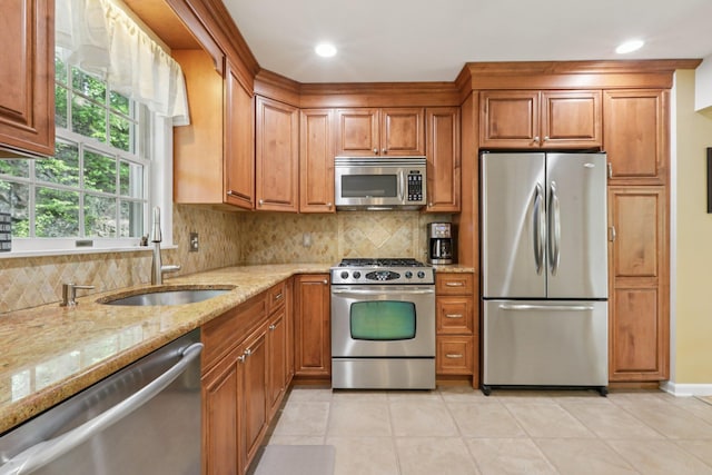 3 Hoyt Ct, Stony Point, NY 10980 - kitchen featuring stainless steel appliances, brown cabinets, light stone countertops, tasteful backsplash, and recessed lighting