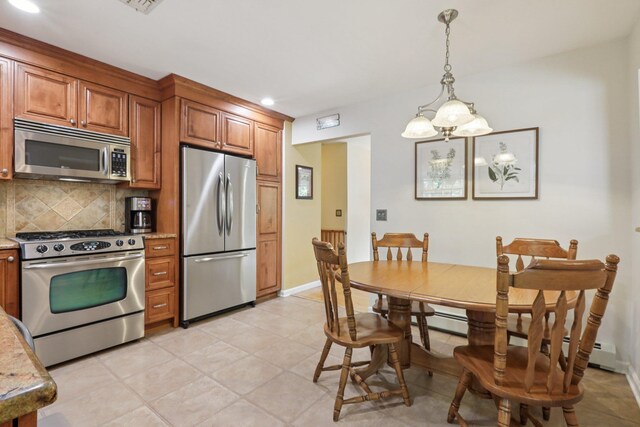 3 Hoyt Ct, Stony Point, NY 10980 - kitchen with appliances with stainless steel finishes, brown cabinetry, backsplash, hanging light fixtures, and recessed lighting