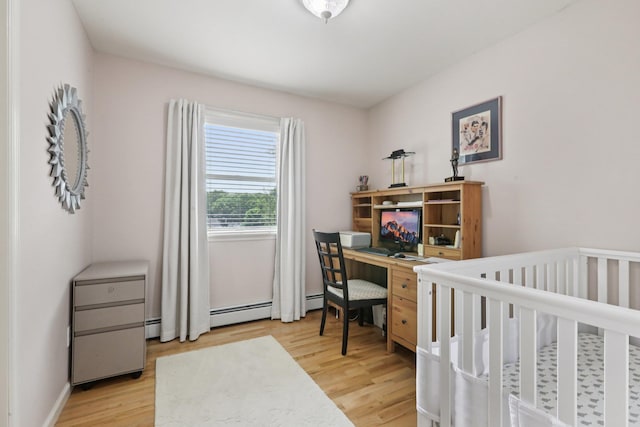 3 Hoyt Ct, Stony Point, NY 10980 - bedroom with light wood finished floors, a baseboard radiator, and an office area