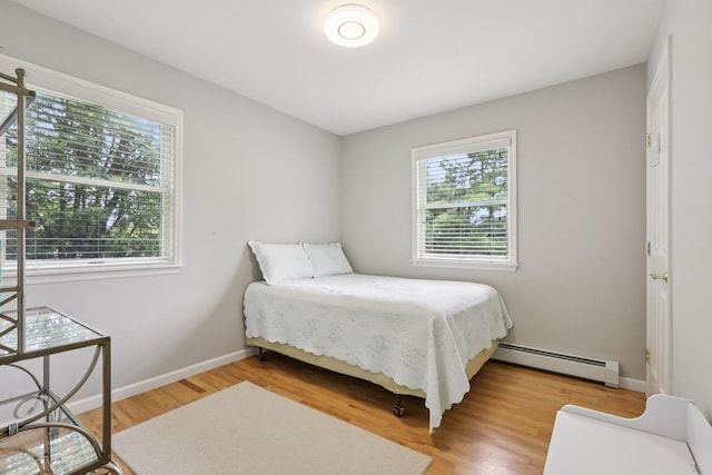3 Hoyt Ct, Stony Point, NY 10980 - bedroom featuring baseboard heating, multiple windows, and light wood finished floors