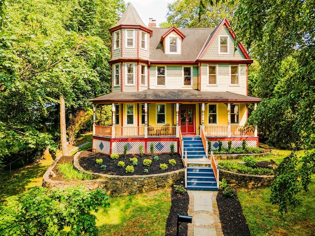 33 Ridge Rd, Ardsley, NY 10502 - victorian-style house with covered porch, stairs, and a chimney