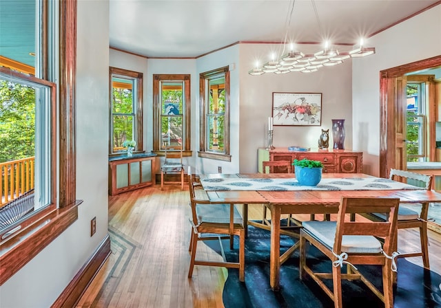 33 Ridge Rd, Ardsley, NY 10502 - dining area with plenty of natural light, hardwood / wood-style floors, and crown molding