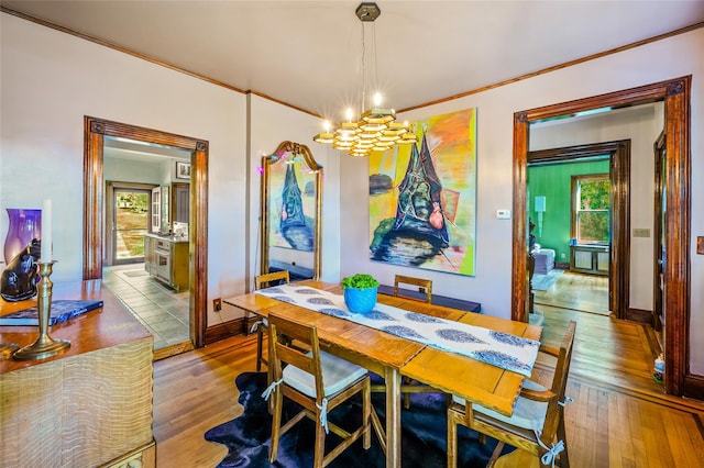 33 Ridge Rd, Ardsley, NY 10502 - dining area featuring a chandelier, hardwood / wood-style floors, ornamental molding, and plenty of natural light