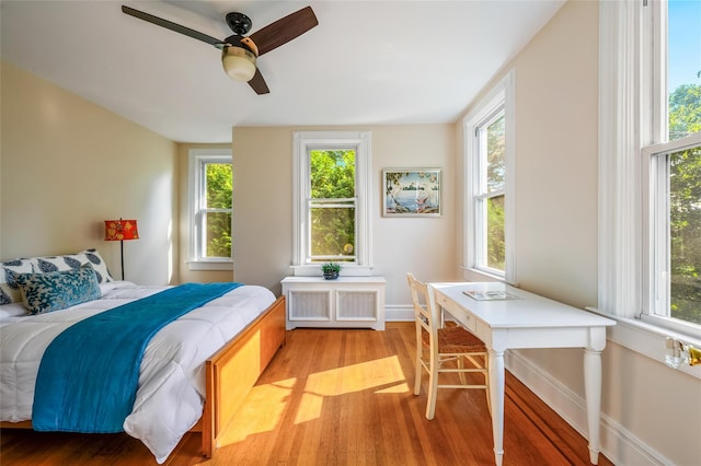 33 Ridge Rd, Ardsley, NY 10502 - bedroom featuring light wood-style floors, multiple windows, and a ceiling fan
