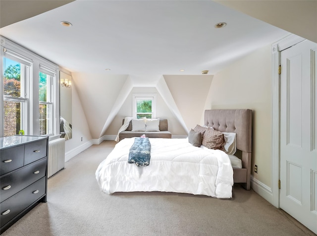 33 Ridge Rd, Ardsley, NY 10502 - bedroom with radiator heating unit, light colored carpet, lofted ceiling, and recessed lighting
