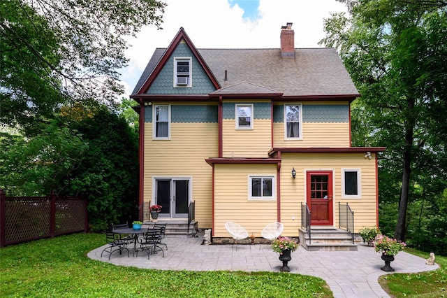 33 Ridge Rd, Ardsley, NY 10502 - back of property featuring entry steps, a chimney, a patio area, and a shingled roof