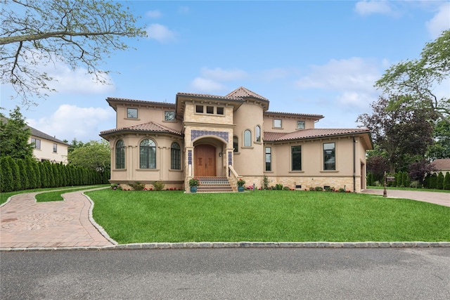 1190 Harbor Rd, Hewlett Harbor, NY 11557 - mediterranean / spanish-style home with a front lawn, stucco siding, and a tiled roof