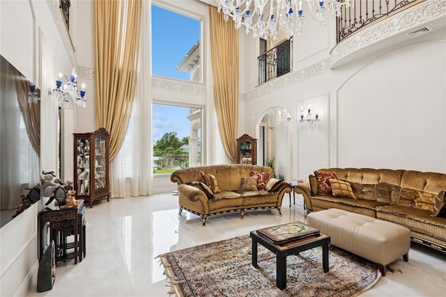 1190 Harbor Rd, Hewlett Harbor, NY 11557 - living room with a high ceiling, a chandelier, and marble tiled flooring