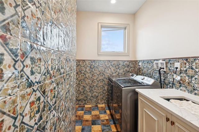 1190 Harbor Rd, Hewlett Harbor, NY 11557 - washroom with cabinet space, tile walls, washing machine and clothes dryer, a wainscoted wall, and recessed lighting