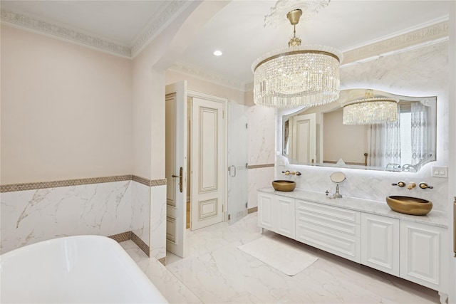 1190 Harbor Rd, Hewlett Harbor, NY 11557 - full bath featuring a chandelier, a freestanding tub, ornamental molding, double vanity, and marble tiled flooring