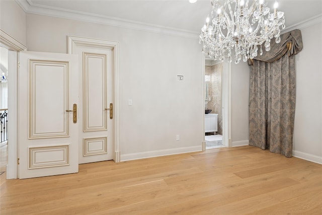 1190 Harbor Rd, Hewlett Harbor, NY 11557 - spare room featuring a chandelier, wood finished floors, and crown molding