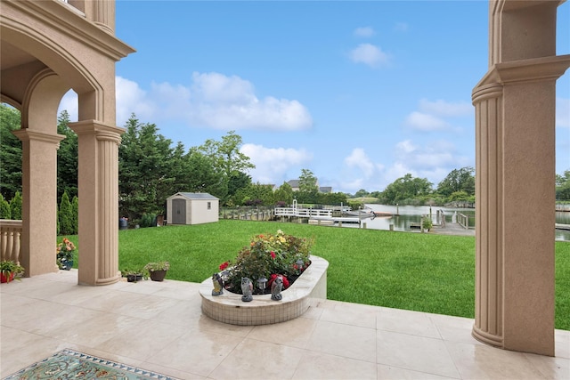 1190 Harbor Rd, Hewlett Harbor, NY 11557 - view of patio featuring a shed and a water view