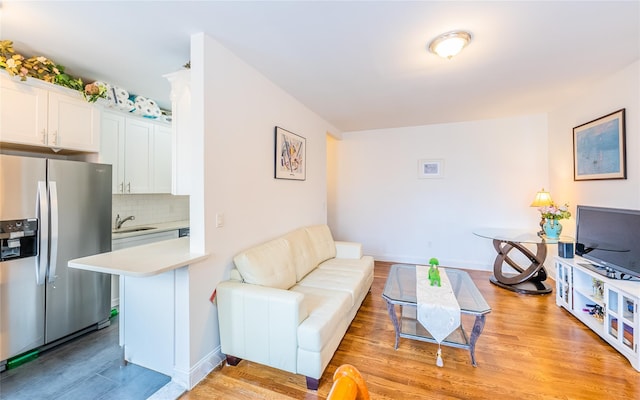6109 39th Ave Unit J3, Woodside, NY 11377 - living area featuring light wood-type flooring and baseboards
