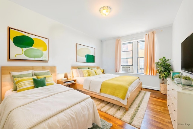 6109 39th Ave Unit J3, Woodside, NY 11377 - bedroom featuring wood finished floors and cooling unit