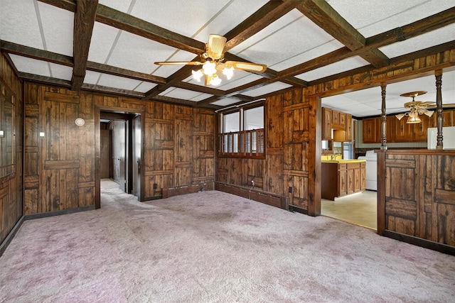 16 King St, Port Jervis, NY 12771 - unfurnished living room featuring a ceiling fan, wooden walls, coffered ceiling, carpet, and beamed ceiling