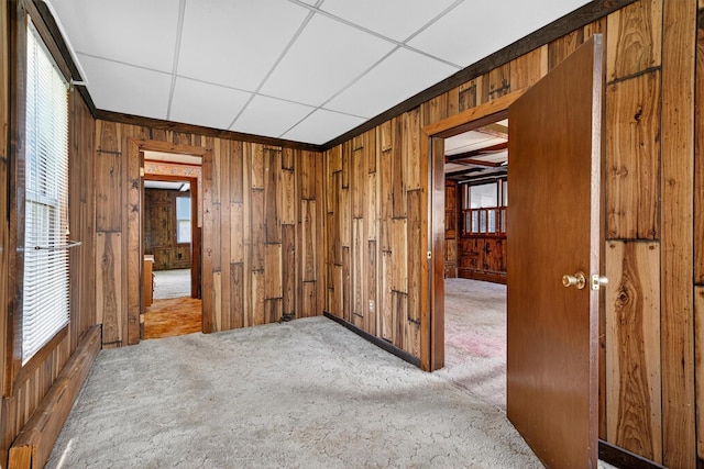 16 King St, Port Jervis, NY 12771 - carpeted empty room with wood walls and baseboard heating