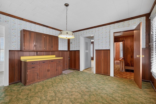 16 King St, Port Jervis, NY 12771 - kitchen featuring wallpapered walls, ornamental molding, a wainscoted wall, decorative light fixtures, and brown cabinetry