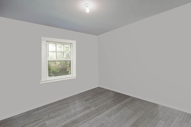 27 Dana Ave, Mastic, NY 11950 - spare room featuring wood finished floors and baseboards