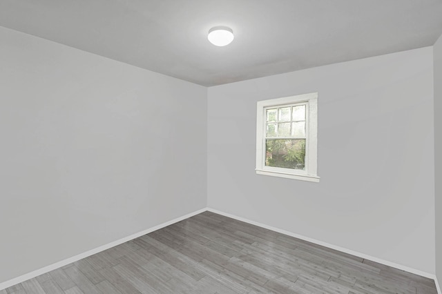 27 Dana Ave, Mastic, NY 11950 - spare room featuring wood finished floors