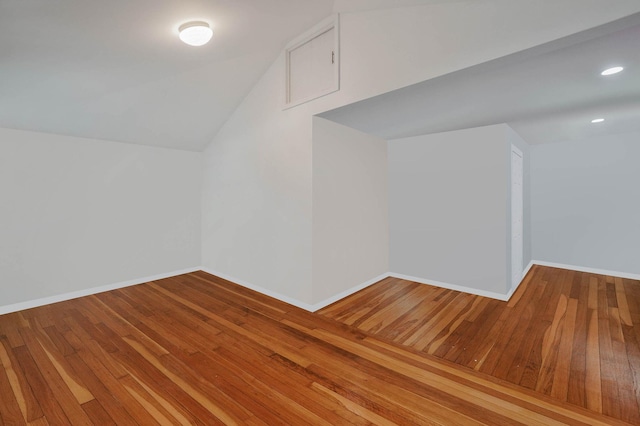 27 Dana Ave, Mastic, NY 11950 - additional living space with hardwood / wood-style floors, lofted ceiling, and recessed lighting