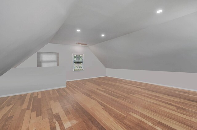 27 Dana Ave, Mastic, NY 11950 - bonus room featuring light wood-style flooring, lofted ceiling, and recessed lighting