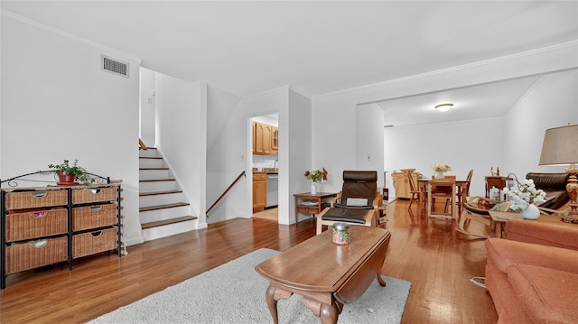 7 Kings Ln, Montrose, NY 10548 - living room with wood finished floors, crown molding, and stairs