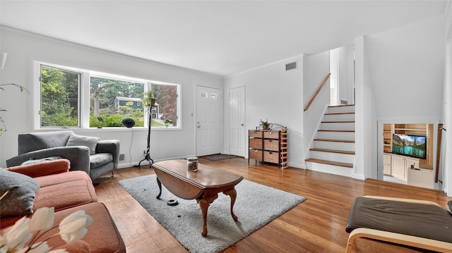 7 Kings Ln, Montrose, NY 10548 - living area with stairs, wood finished floors, and ornamental molding