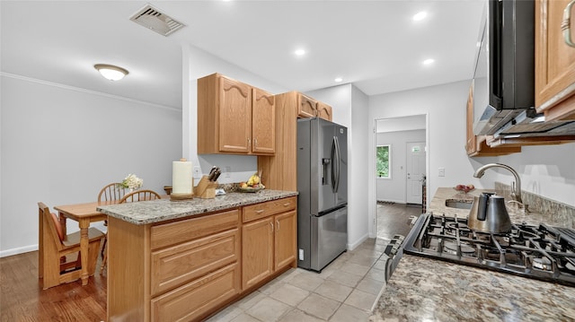 7 Kings Ln, Montrose, NY 10548 - kitchen with appliances with stainless steel finishes, light stone countertops, recessed lighting, and ornamental molding