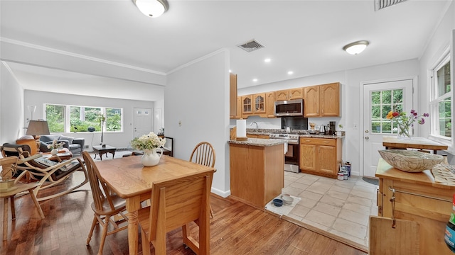 7 Kings Ln, Montrose, NY 10548 - dining room with healthy amount of natural light, recessed lighting, light wood-style flooring, and ornamental molding