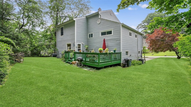 7 Kings Ln, Montrose, NY 10548 - back of property with a yard, a deck, and a chimney