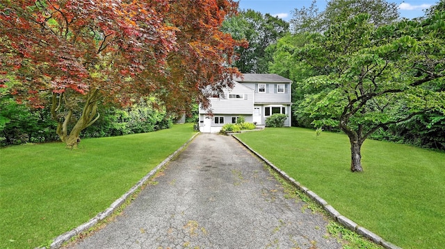 7 Kings Ln, Montrose, NY 10548 - view of front facade with asphalt driveway and a front yard