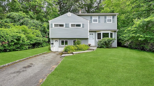 7 Kings Ln, Montrose, NY 10548 - view of front of home featuring a front lawn and asphalt driveway
