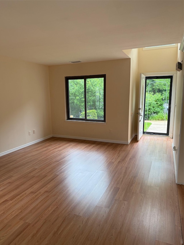 1012 Skyline Dr, Coram, NY 11727 - unfurnished room with plenty of natural light and wood finished floors
