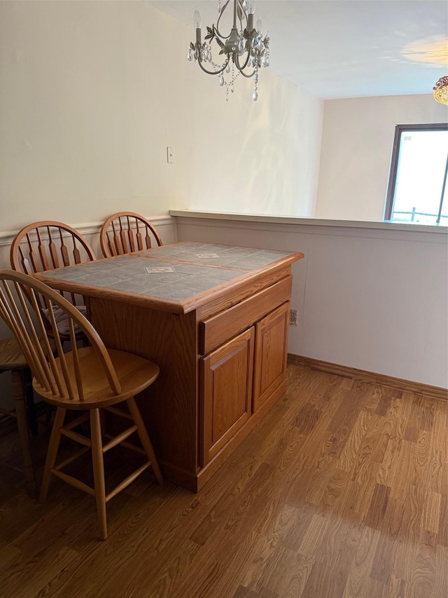 1012 Skyline Dr, Coram, NY 11727 - dining space featuring a chandelier and wood finished floors