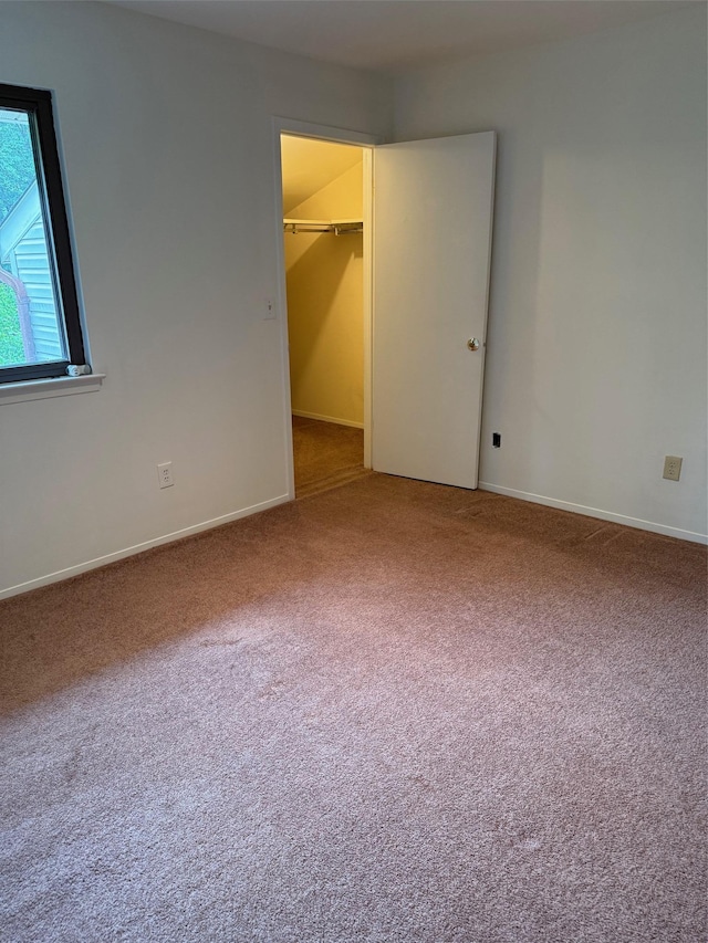 1012 Skyline Dr, Coram, NY 11727 - unfurnished bedroom with carpet, a spacious closet, and a closet