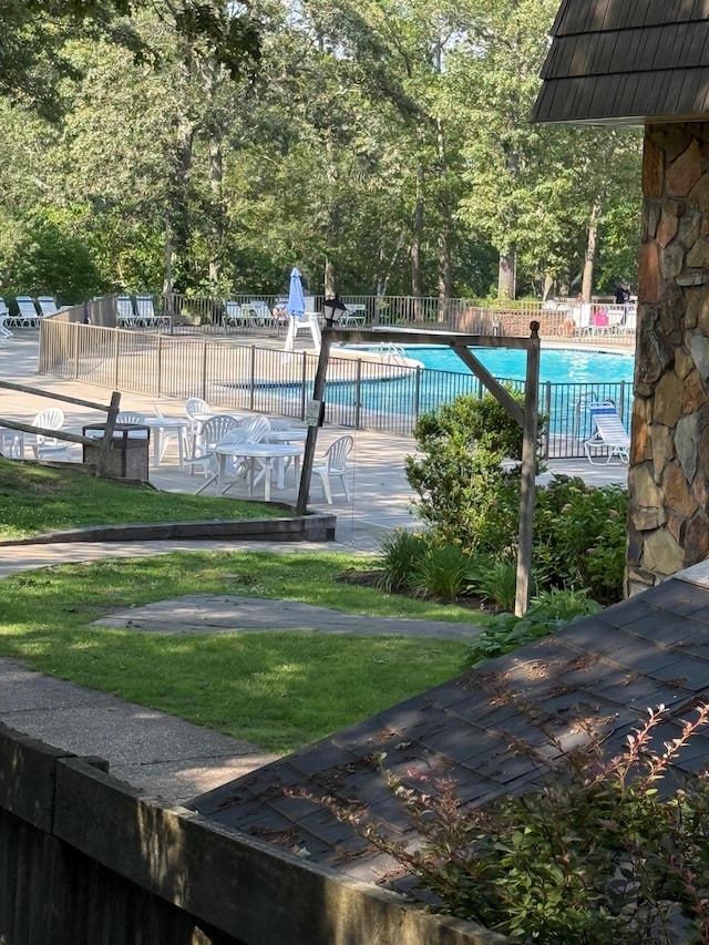 1012 Skyline Dr, Coram, NY 11727 - view of tennis court featuring a community pool
