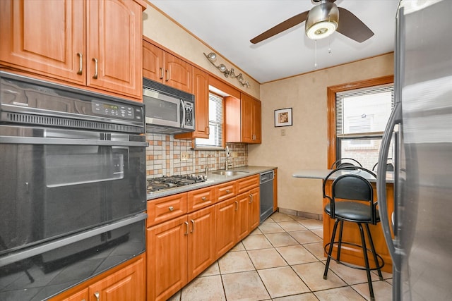 33-50 210th St, Bayside, NY 11361 - kitchen featuring black appliances, a warming drawer, backsplash, a ceiling fan, and light tile patterned floors