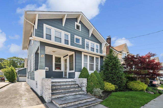 49 Waldo Ave, East Rockaway, NY 11518 - view of front of property with a porch and a detached garage