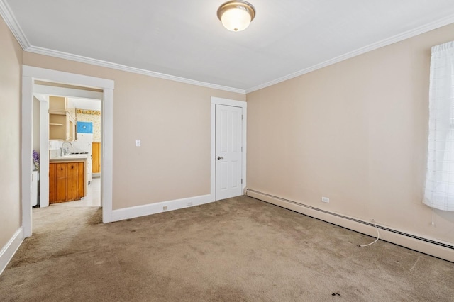 49 Waldo Ave, East Rockaway, NY 11518 - spare room featuring baseboard heating, crown molding, and carpet flooring